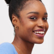 Heart Huggie Hoop Earrings Gold on Model