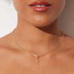 Mini Horseshoe Charm on model