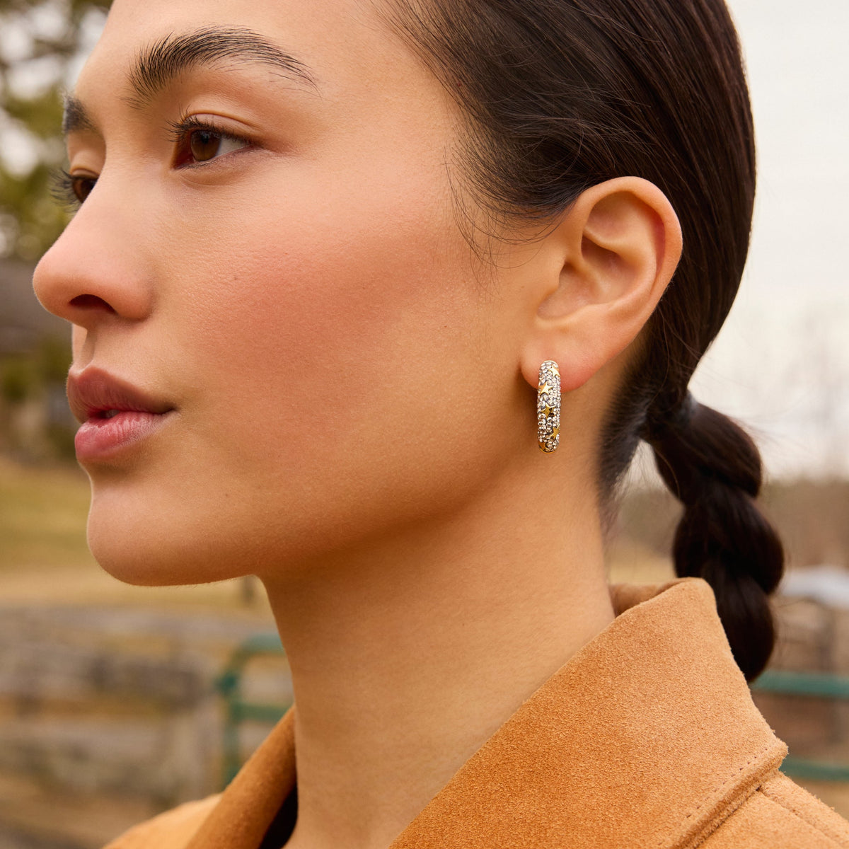 Silver Shade Star Studded Medium Sparkle Hoop Earrings on model