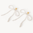 Pearl Present Statement Earrings laying flat