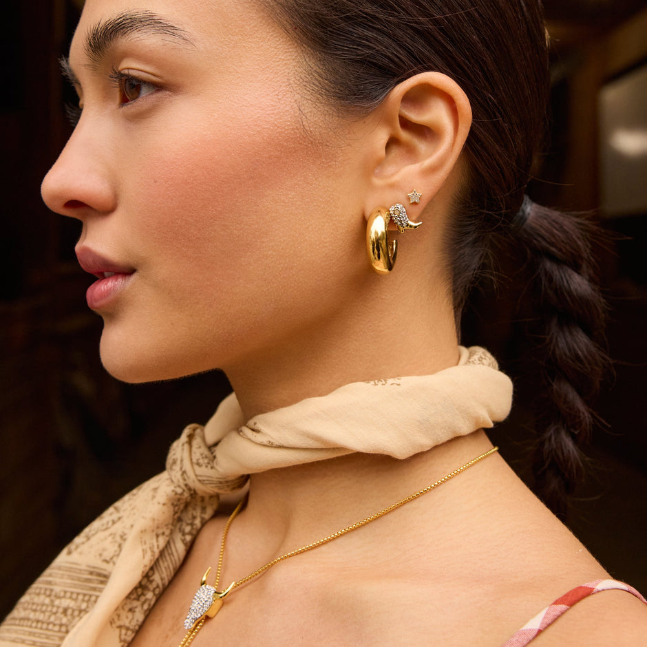 Ride Boot Sparkle Stud Earrings and Chunky Statement Hoop on model