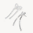 Tennis Bow Statement Earrings laying flat