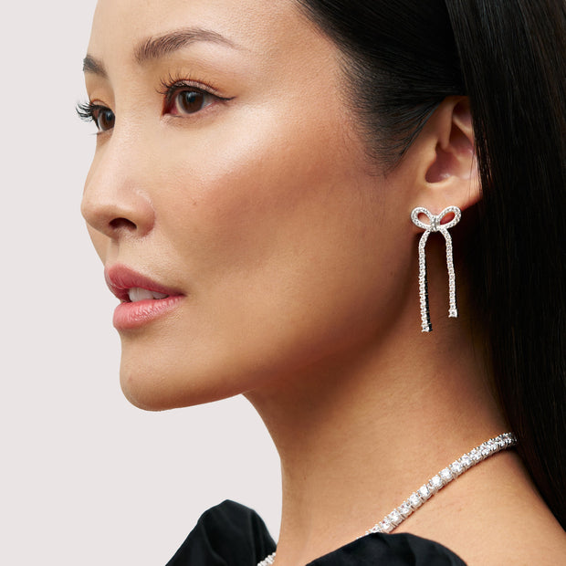 Tennis Bow Statement Earrings on model